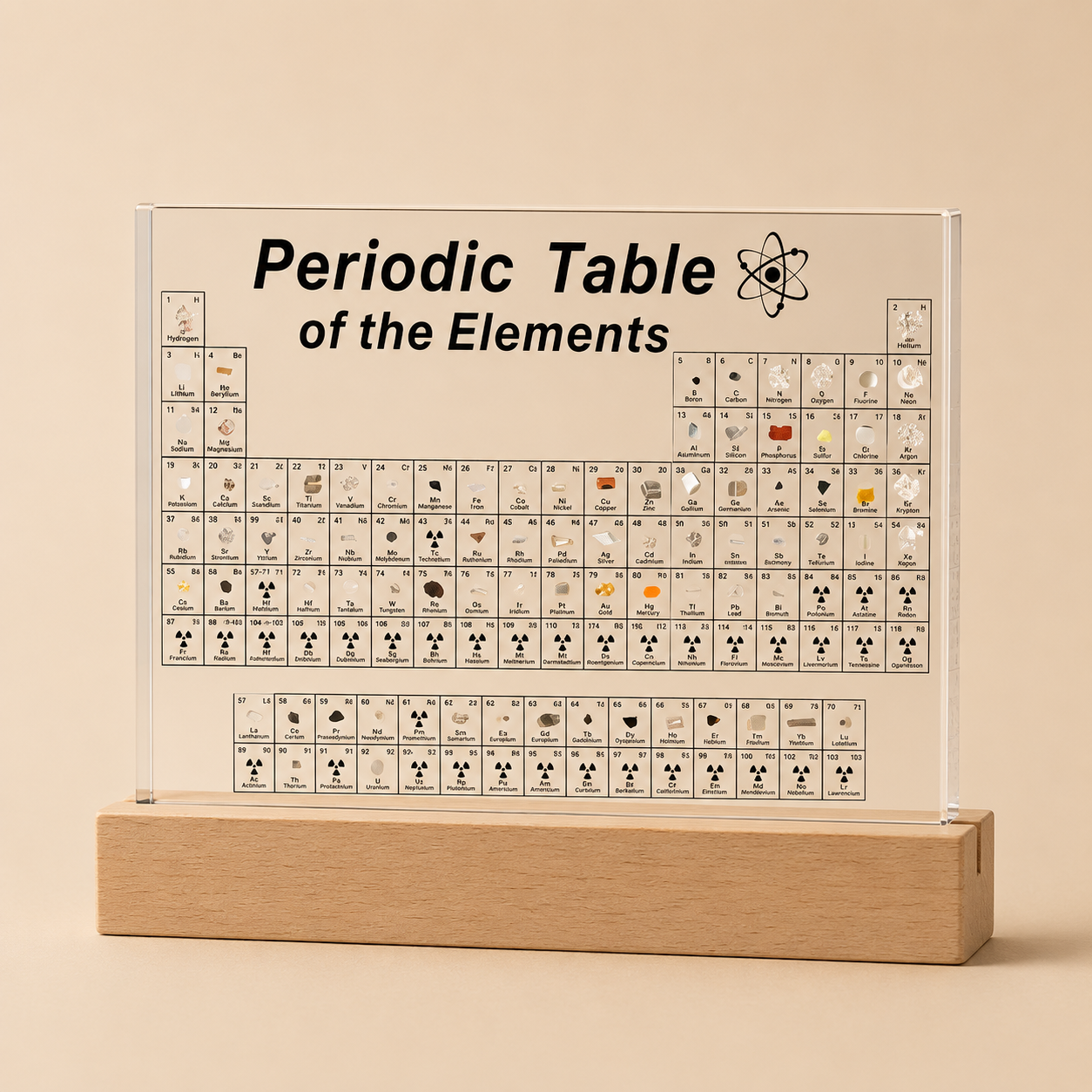 Periodic Table of Elements on a clear acrylic panel with wooden base on a beige background